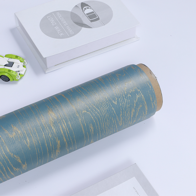 How is the wood grain effect of wood grain pvc decorative sheet achieved?