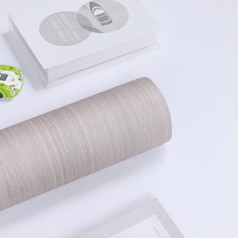 How do PVC decorative sheets maintain their long-term flatness when applied flat?